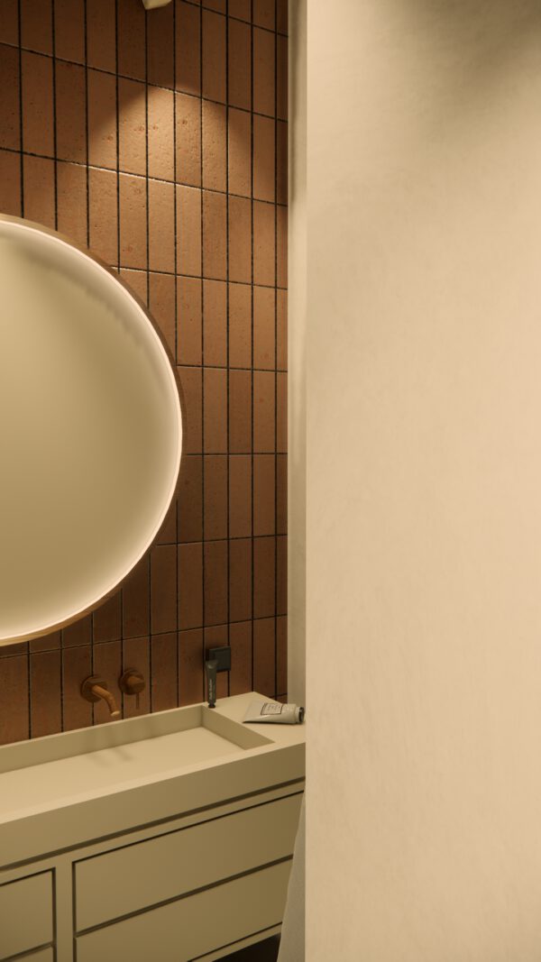 Badkamer in wabi sabi woning Heenvliet met donkere tegels en indirect licht
